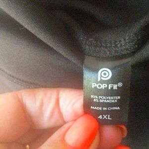 Black polyester and spandex workout pants with pockets on both sides.